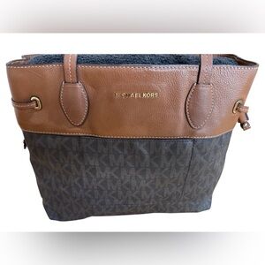 Used Michael Kors, see pictures for arm strap needs to be fixed.